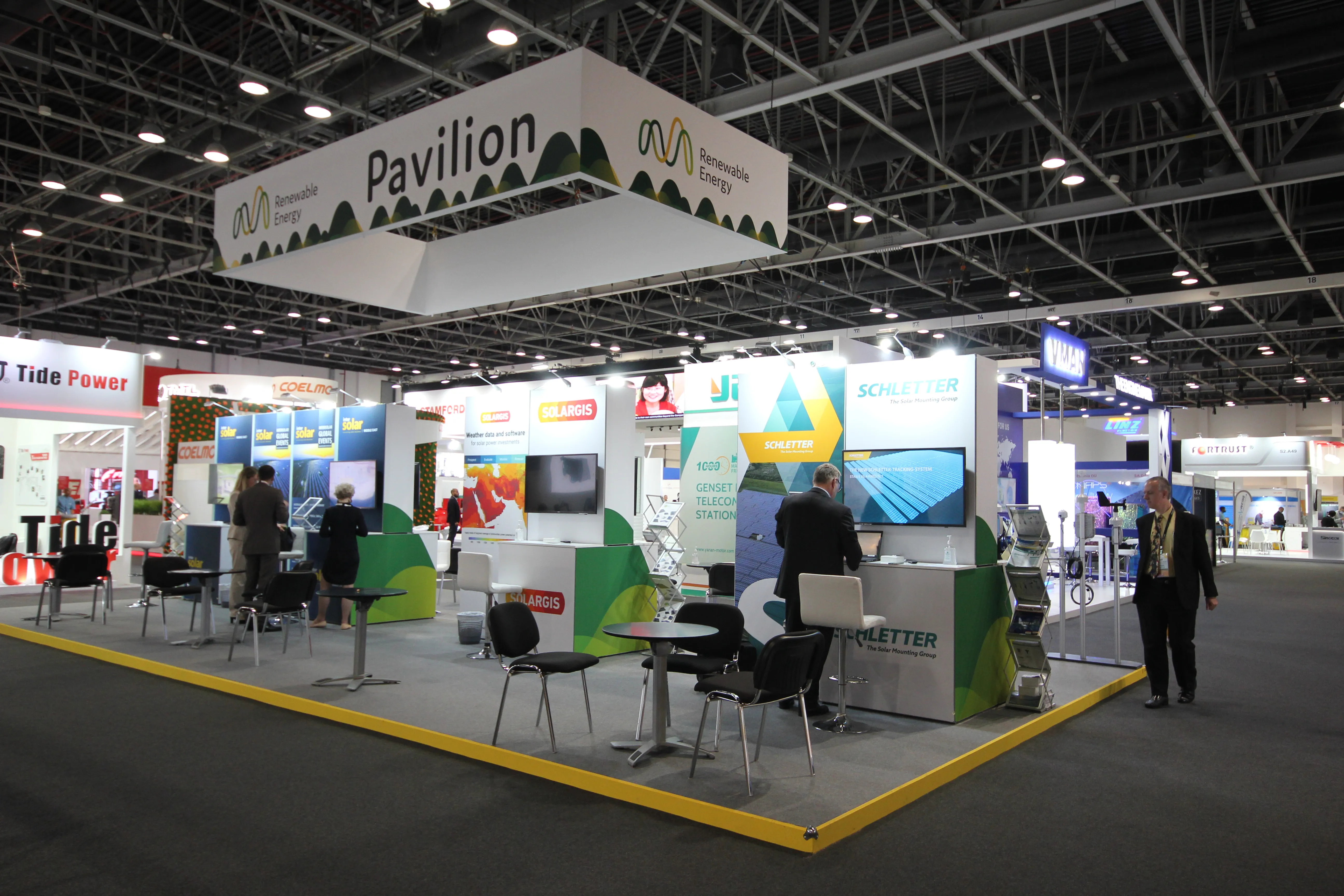 Custom exhibition stand with a branded reception and meeting area